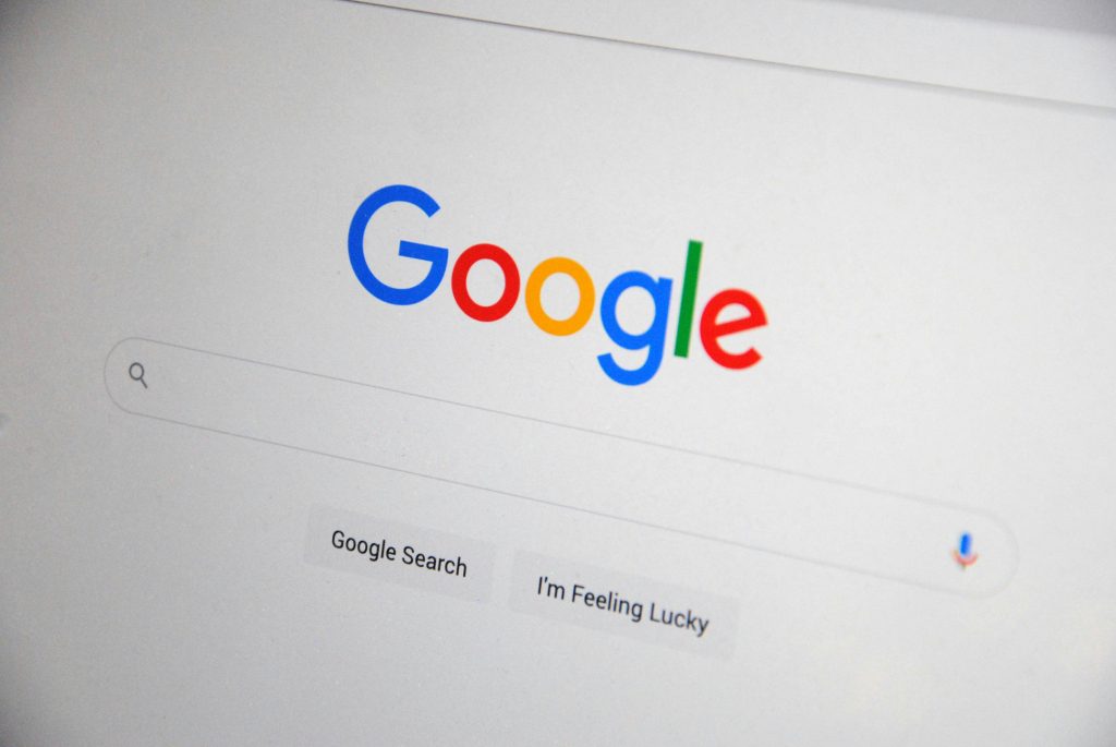 pexels-photo-13628541-13628541 Close-up of the Google homepage on a screen showing search options.